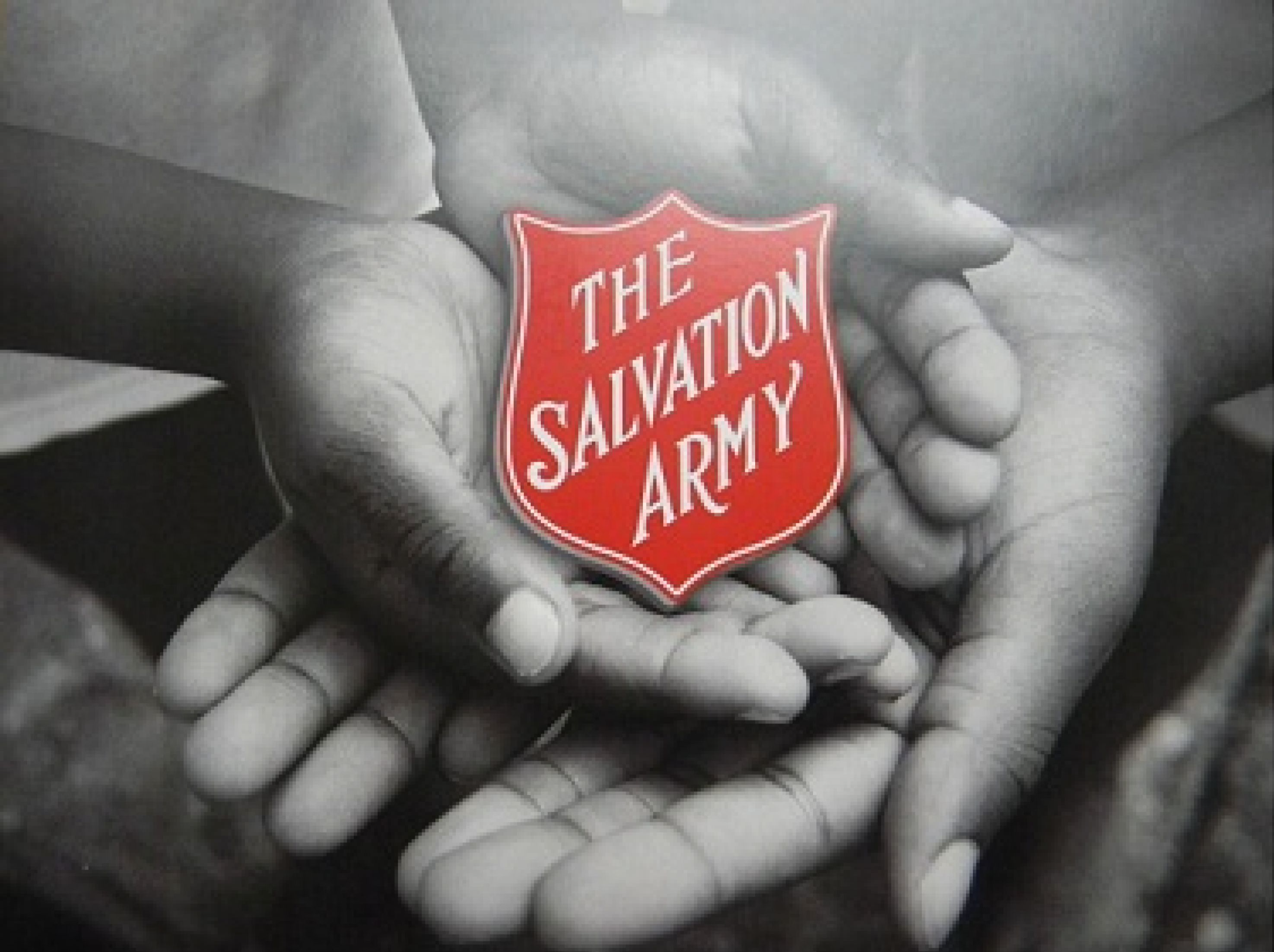 Hands holding a logo of The Salvation Army